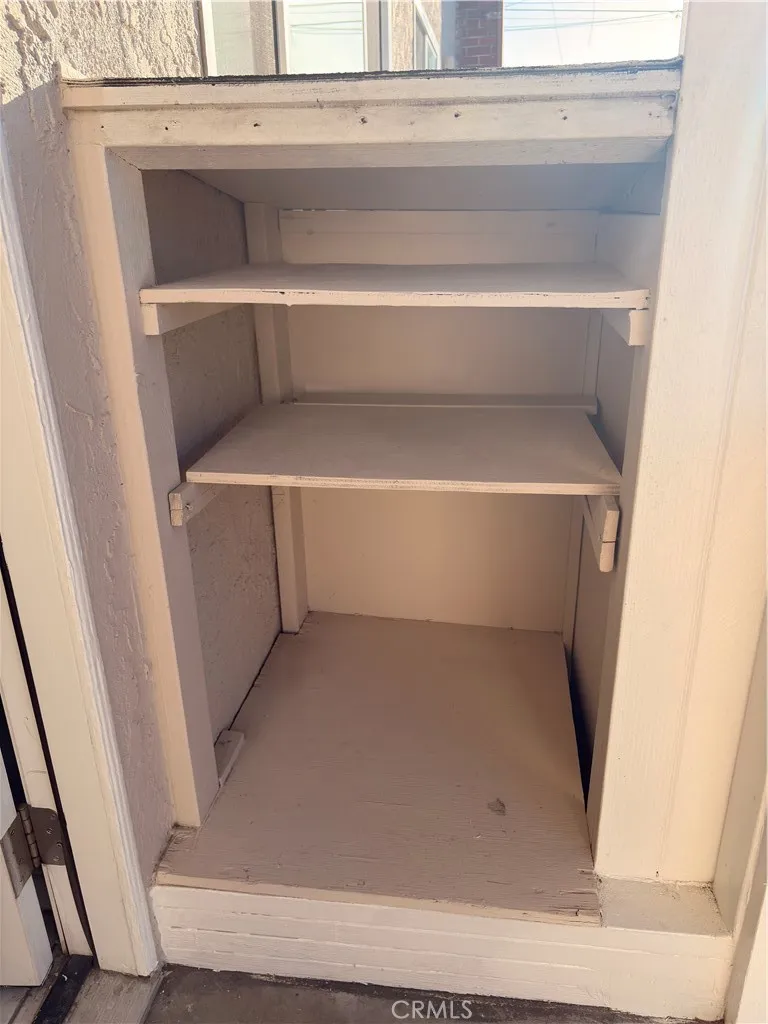 Shoes cabinet in front of the side door entrance