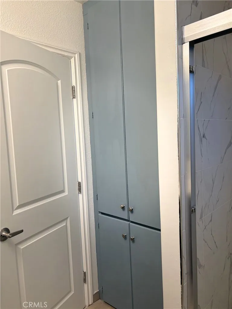 Linens cabinets inside the shared shower