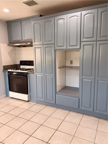 Many cabinets in the kitchen area