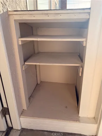 Shoes cabinet in front of the side door entrance