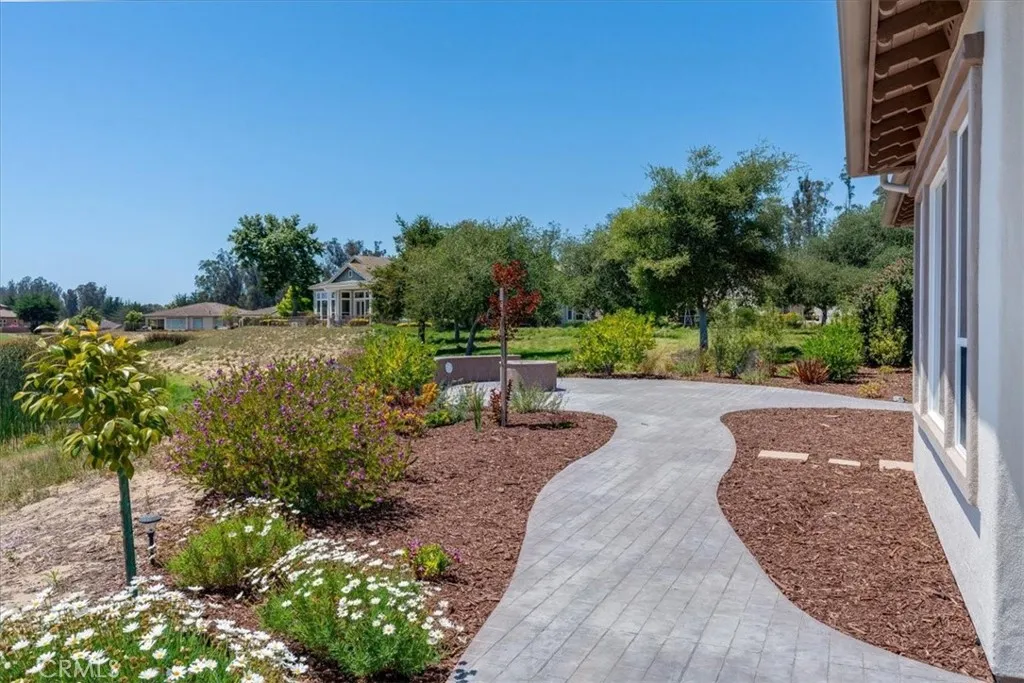 Showcasing a Large Backyard With Beautiful Pavers