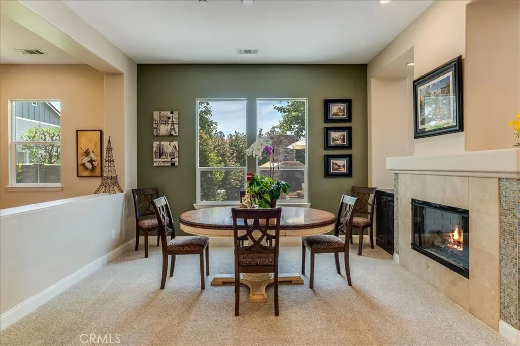 Dining Room or Office with Dual-Sided Fireplace and View of the Free-Standing Newly Built Outdoor Fireplace