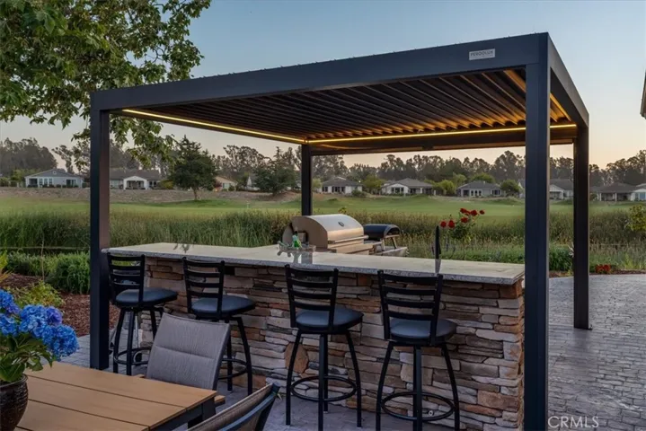 Your View Looking Out From Your Barstool to the 13th Fairway and Lake