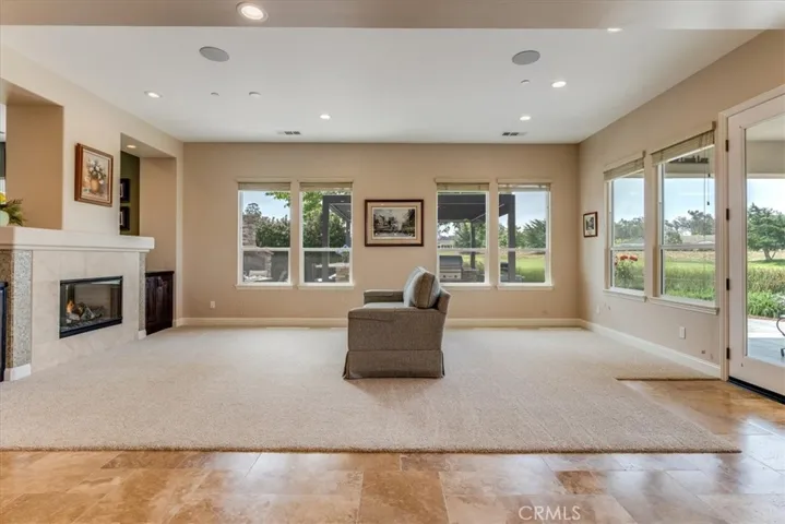 Living Room With One Side of Dual-Sided Fireplace