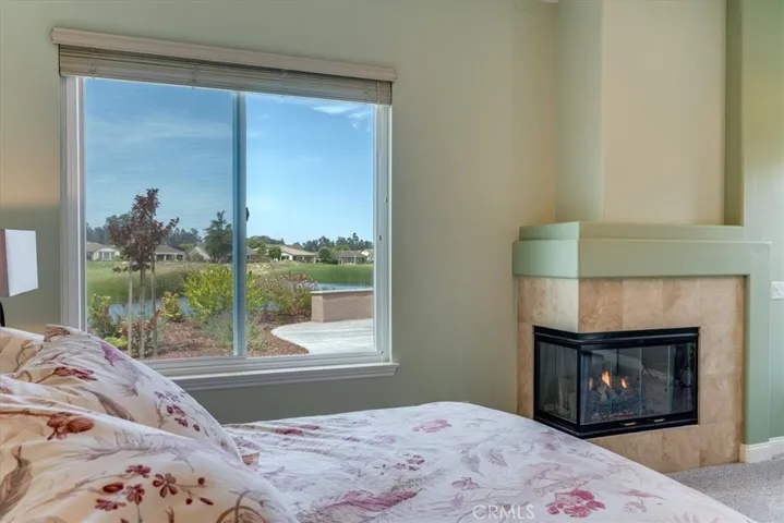 Primary Ensuite With Panoramic Views and Romantic Fireplace