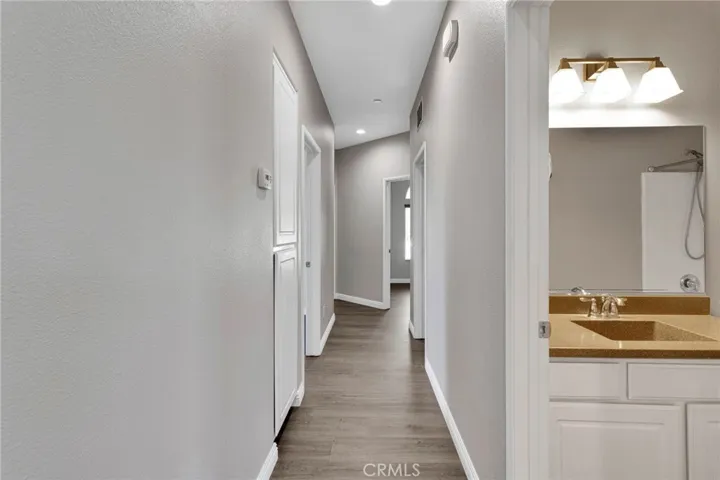 Hallway leading to Guest Bedroom / Bathrooms & Linen Storage Cabinets