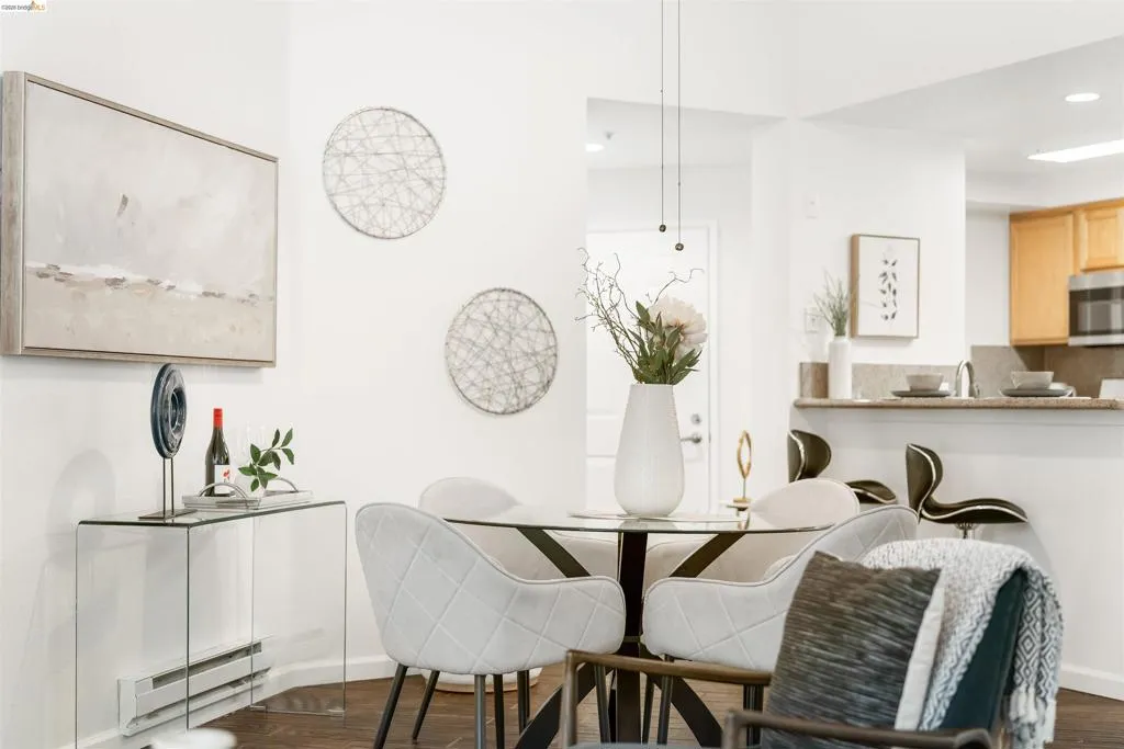 Dining room with a baseboard radiator, dark wood-type flooring, and recessed lighting