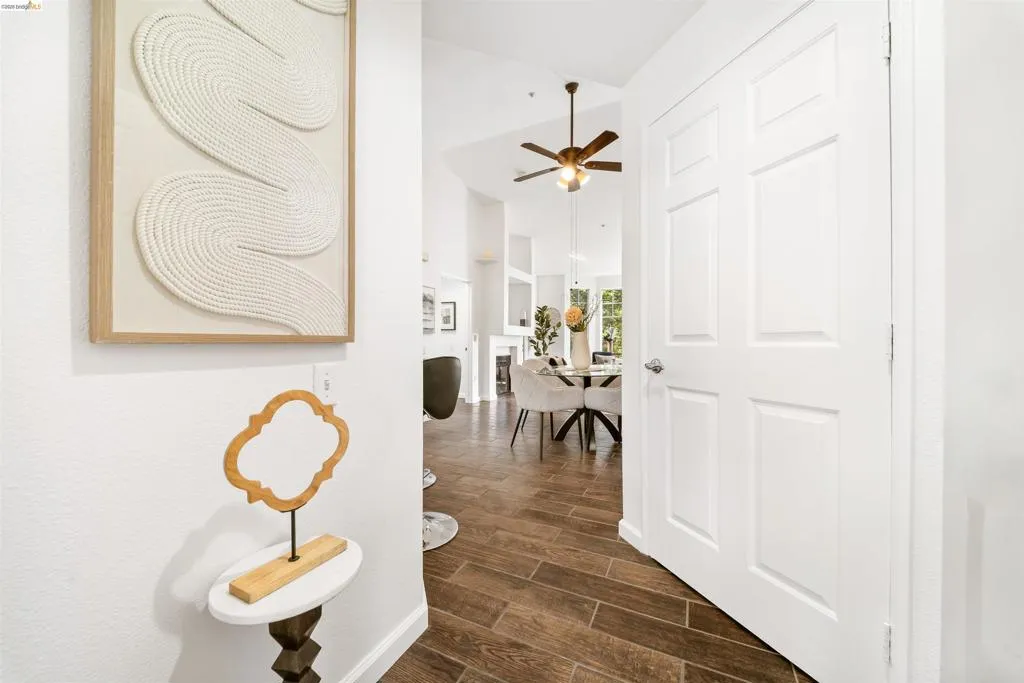 Corridor featuring wood finish floors and baseboards