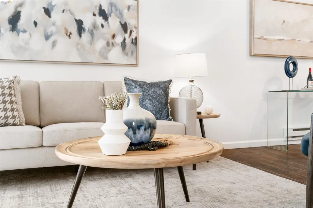 Living area featuring wood finished floors and a baseboard radiator