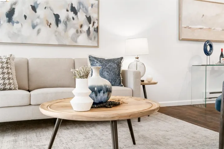Living area featuring wood finished floors and a baseboard radiator