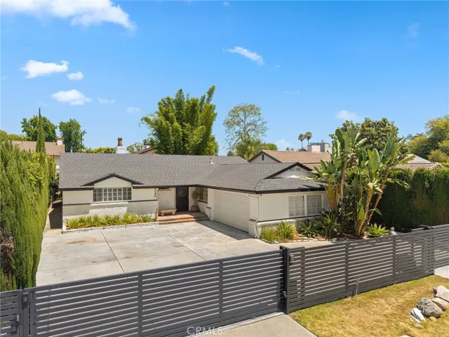 Set back off the street with a gated and private motor court
