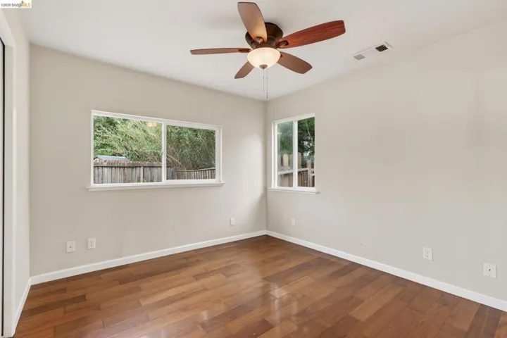Hardwood-finish flooring enhancing a neutral-toned room
