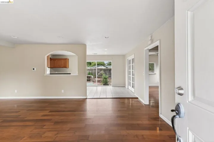 Warm wood-finish flooring extending from the​​‌​​​​‌​​‌‌​​‌​​​‌‌​​​‌​​‌‌​​‌‌​​‌‌​​​​ entryway