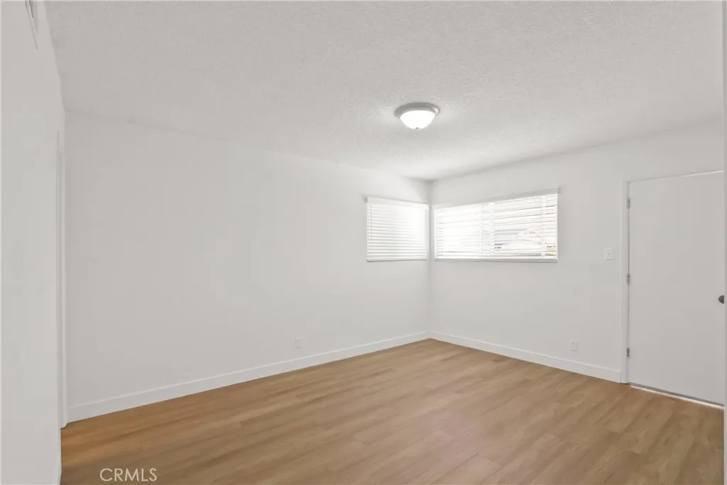 primary bedroom with exit to backyard