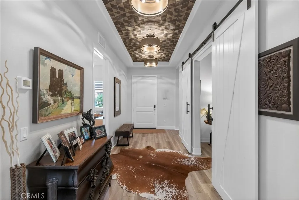 notice the custom tray ceiling and lighting