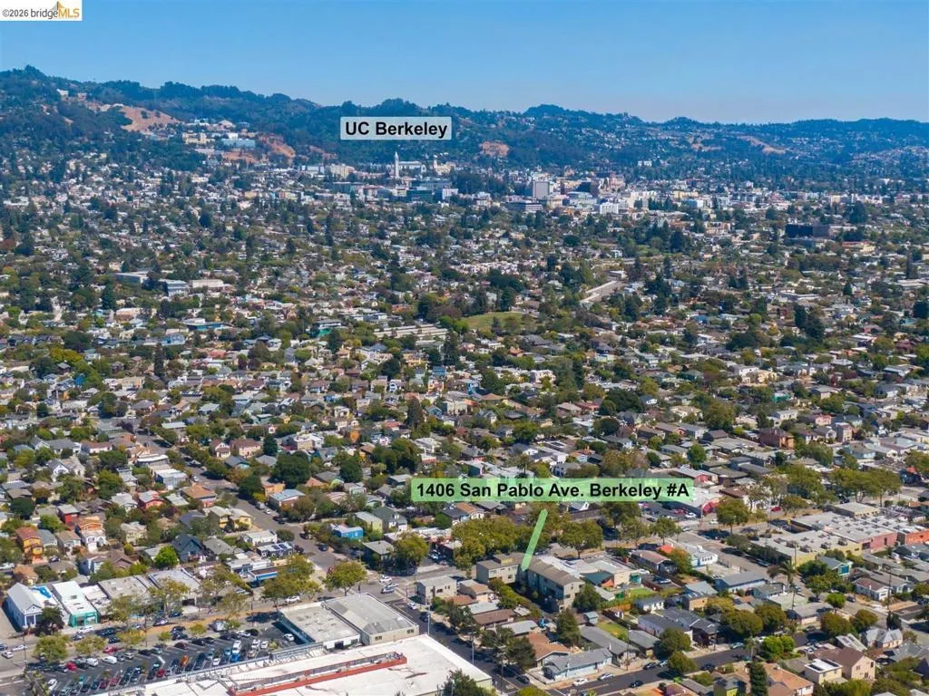 Aerial perspective of a dense urban landscape featuring residential and commercial structures