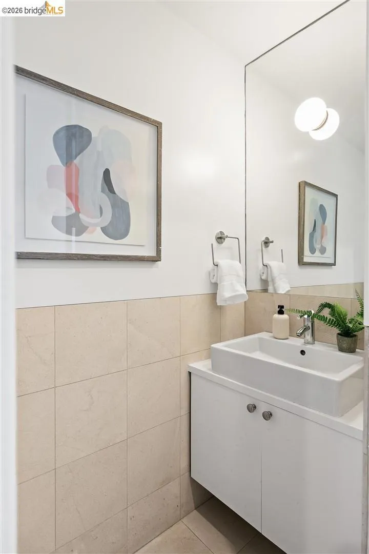 Modern floating vanity with a rectangular vessel sink and chrome faucet