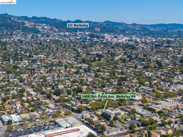 Aerial perspective of a dense urban landscape featuring residential and commercial structures