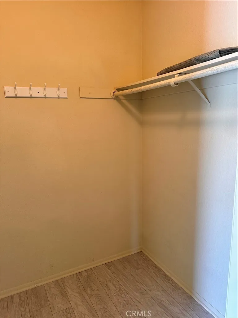 Primary bedroom walk in closet