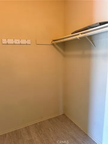 Primary bedroom walk in closet