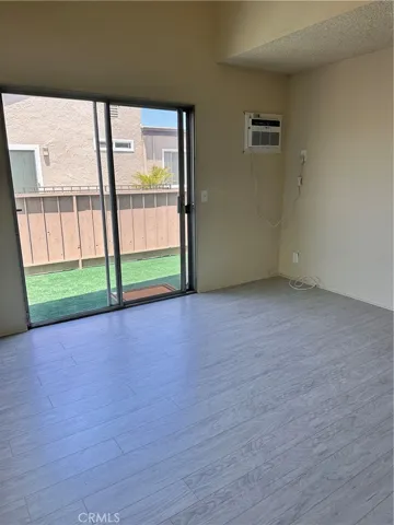 Primary Bedroom with sliding door to balcony