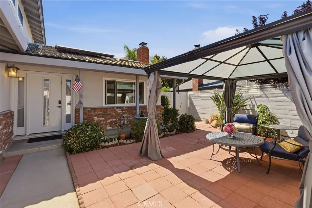 Front of home. Outdoor space inside gate