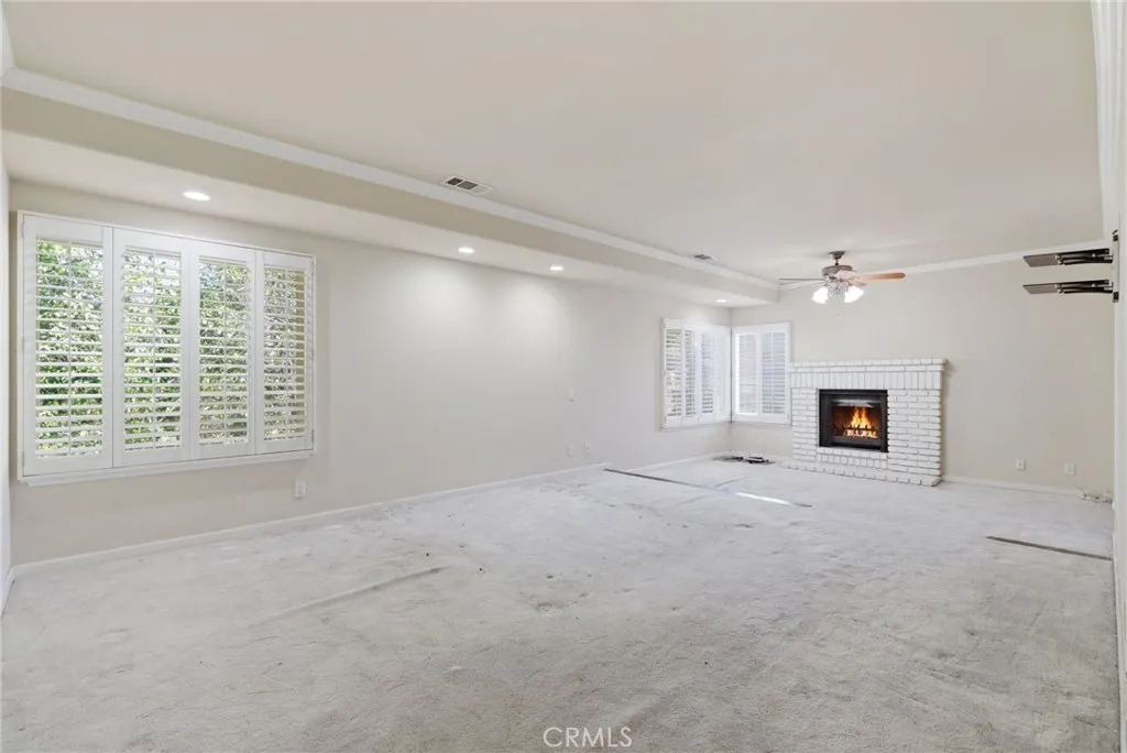 Primary Suite - Bedroom with Fireplace and Wet Bar
