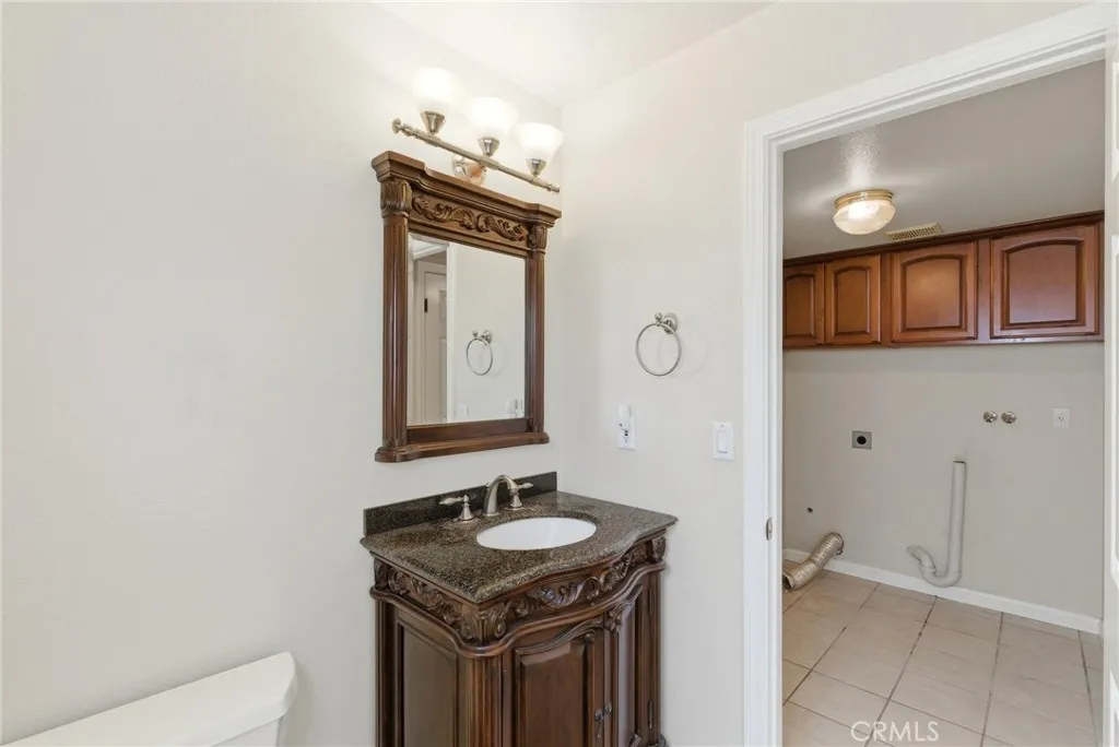 Downstairs Bathroom - Leads to Side Yard and Interior Hallway