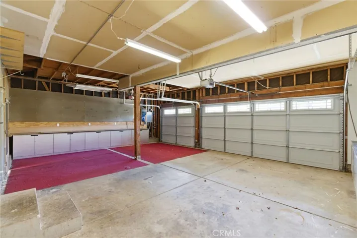 3 Car Garage with EV Charging and Workbenches and Storage