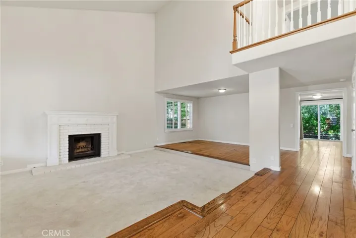Enter Into Living Room and Dining Area with Fireplace