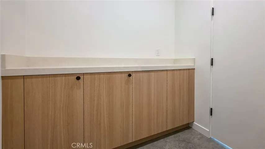 Laundry room folding table and storage