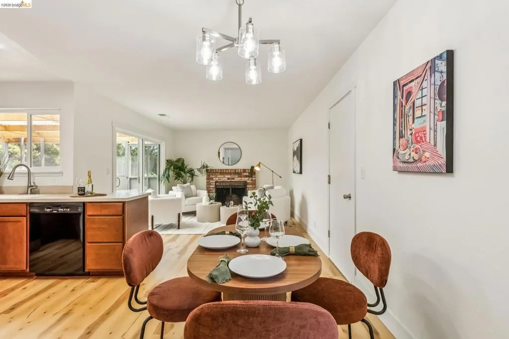 Open-concept interior featuring light wood-finish flooring throughout