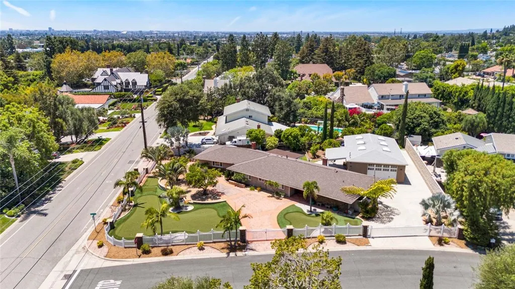 Overhead view shows prime location of corner property with double gated circular drive and separate gate for large 1500 sq. ft. garage.