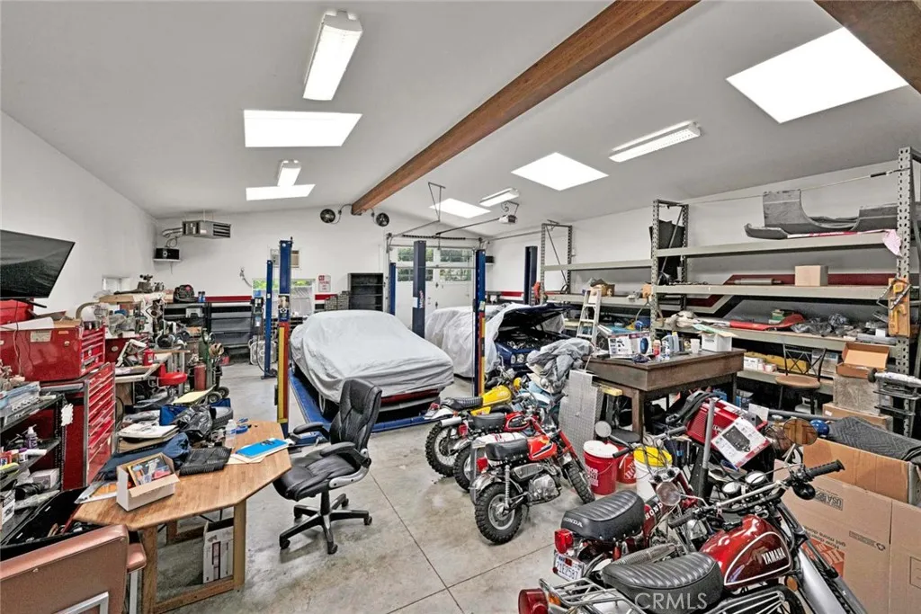 Inside of separate garage showing skylights.