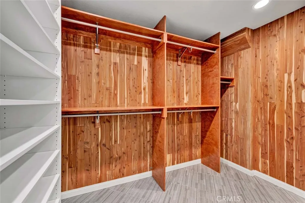 Primary walk in closet lined with cedar (to deter moths) and organizers.