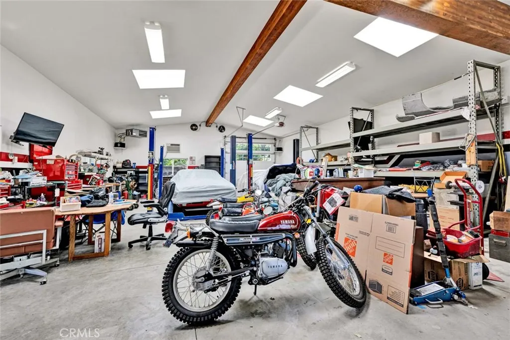 Separate garage showing back door for vehicles.