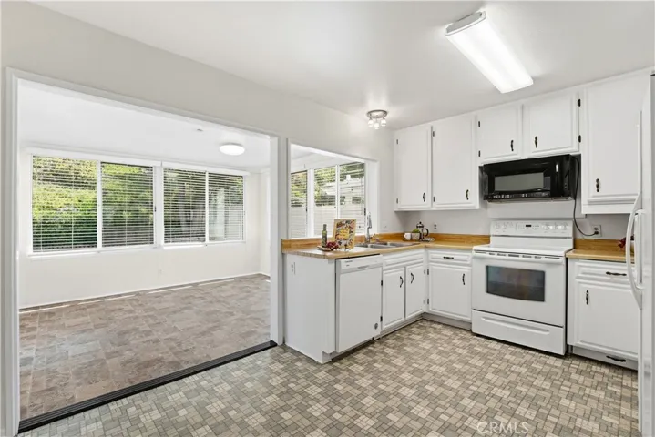 Kitchen also leads into sunroom