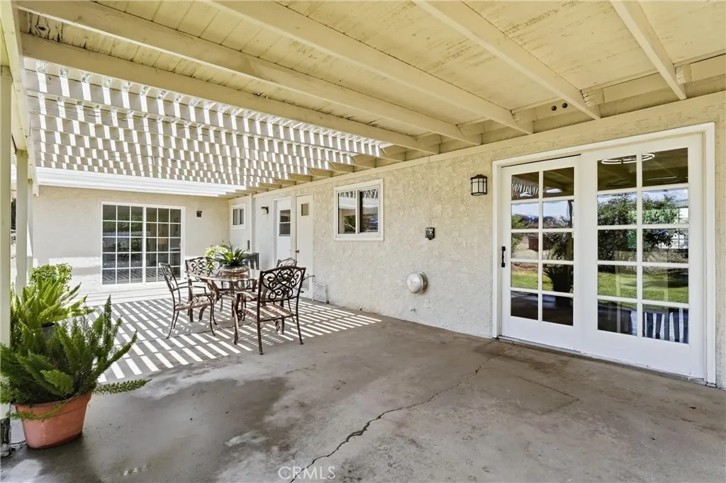 Patio access from kitchen, laundry room and primary bedroom