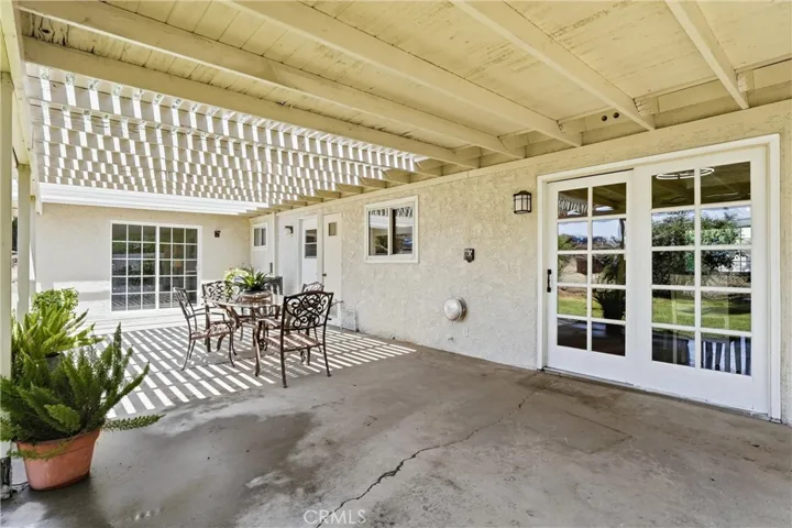 Patio access from kitchen, laundry room and primary bedroom