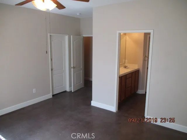 MASTER BEDROOM AND ENTRY TO THE MASTER BATHROOM