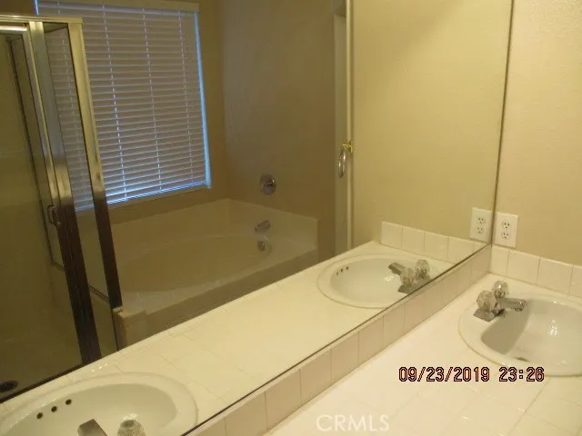 MASTER BATHROOM WITH DOUBLE SINKS AND A SEPARATE TUB & SHOWER