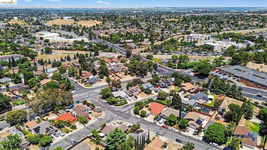 Aerial perspective showcasing a residential neighborhood with a diverse collection of single-story and multi-story homes