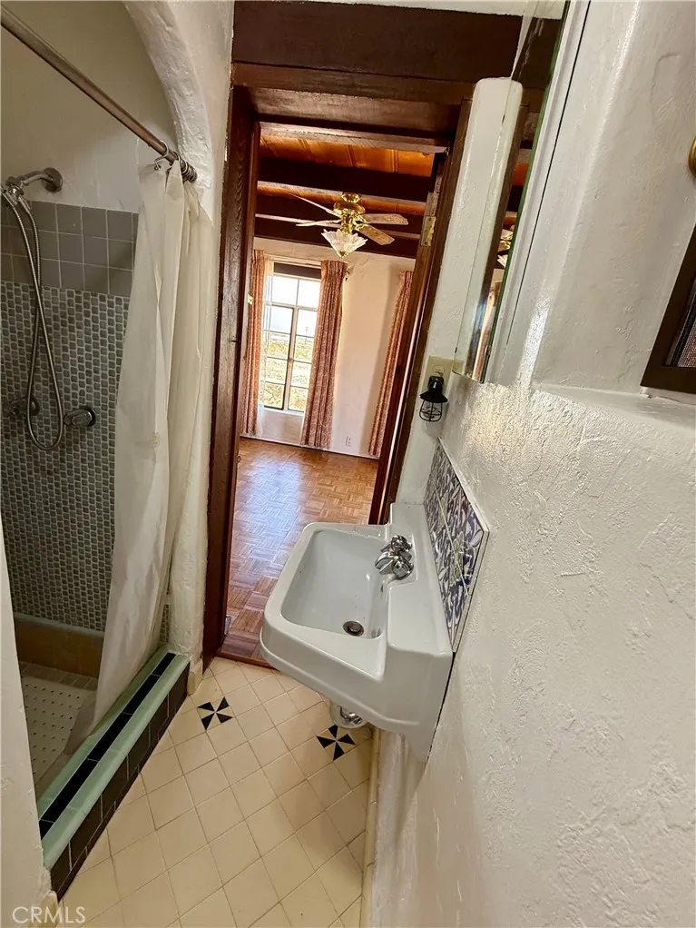 The main house bathroom has access to one of the bedrooms and the hall The main house bathroom has access to one of the bedrooms and the hall