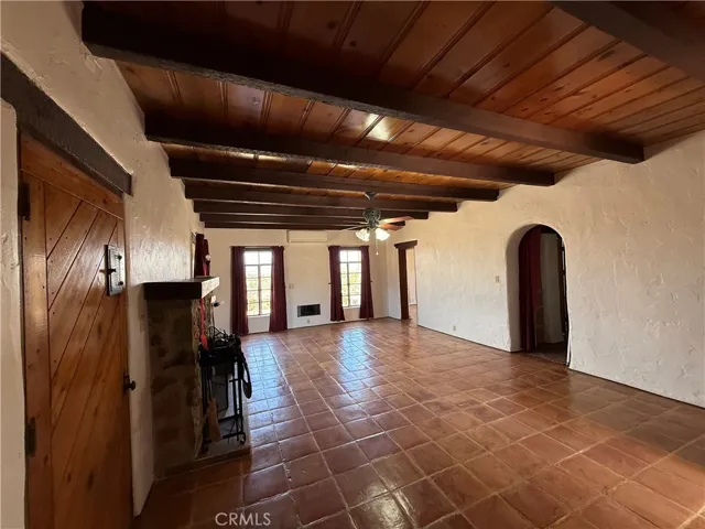 Living room with tile and Open beam ceilings