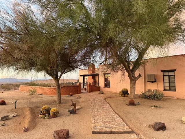 The graceful entry has mature trees