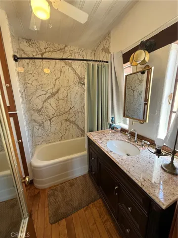 Master bathroom with a tub and shower