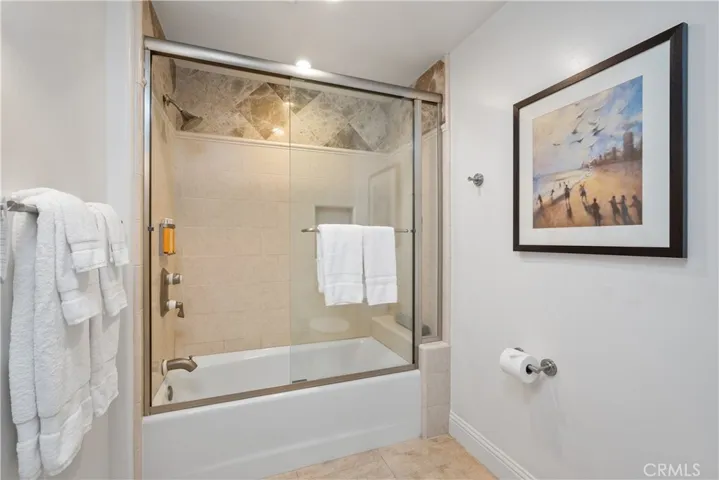Bathroom with shower over tub