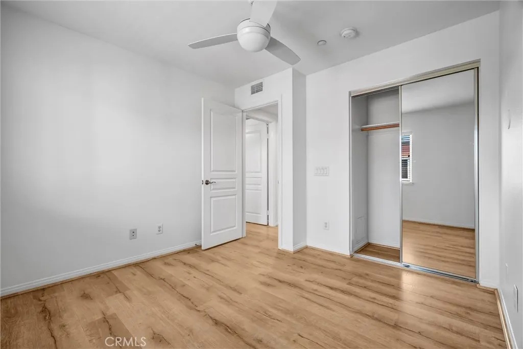 Bedroom #2 with Mirrored Wardrobes and Ceiling Fan