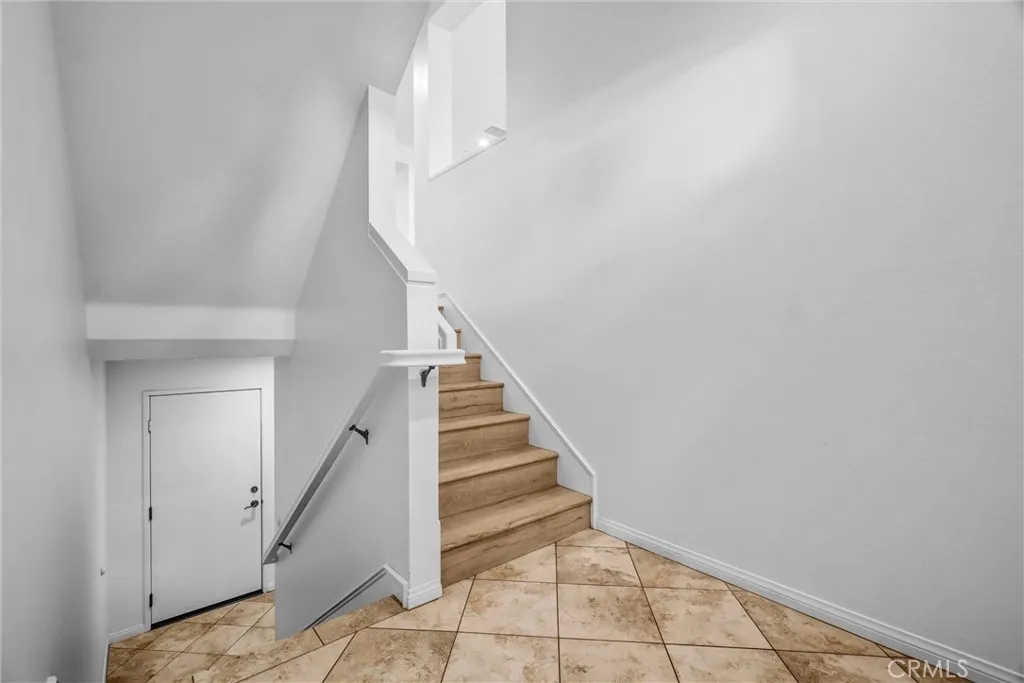 Front door leads to main level and to upstairs bedrooms 1,2,and 3 downstairs to 4th bedroom.