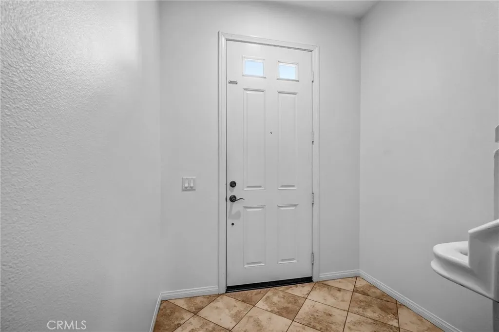 Front Entry Door with access to downstairs Office or stairway to main level.